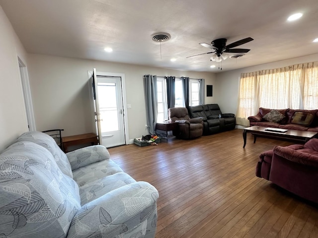 living room with hardwood / wood-style flooring and ceiling fan