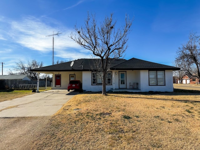 ranch-style home with a carport and a front lawn