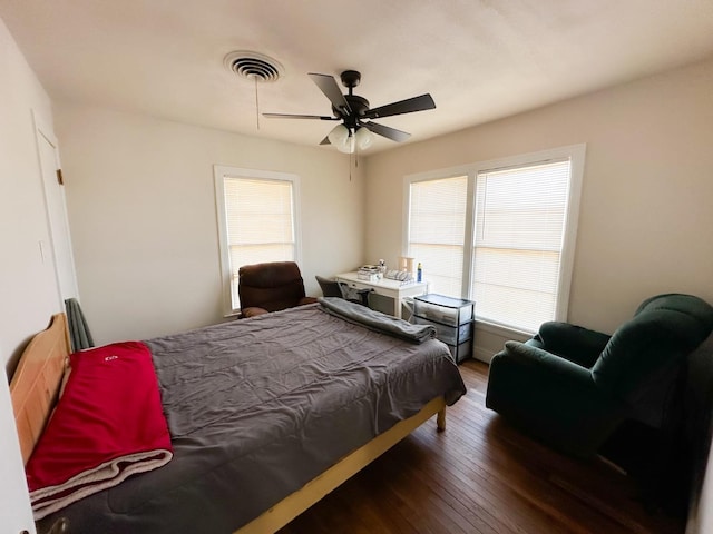 bedroom featuring dark wood-type flooring and ceiling fan