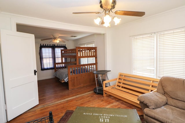 bedroom featuring crown molding and hardwood / wood-style floors