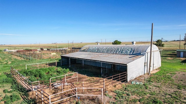 exterior space with an outbuilding and a rural view