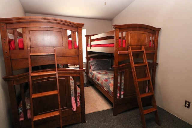 carpeted bedroom featuring vaulted ceiling