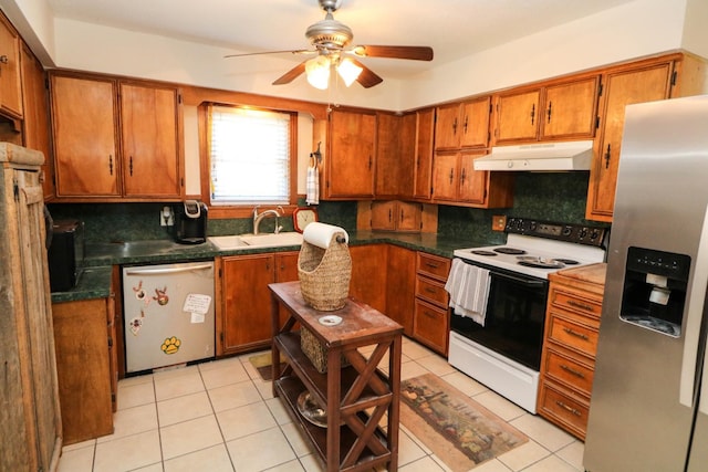 kitchen featuring tasteful backsplash, stainless steel appliances, sink, and light tile patterned floors