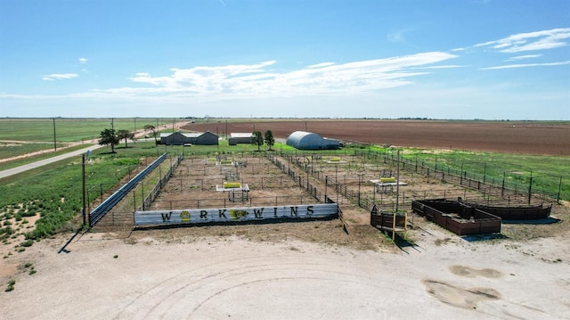 birds eye view of property with a rural view