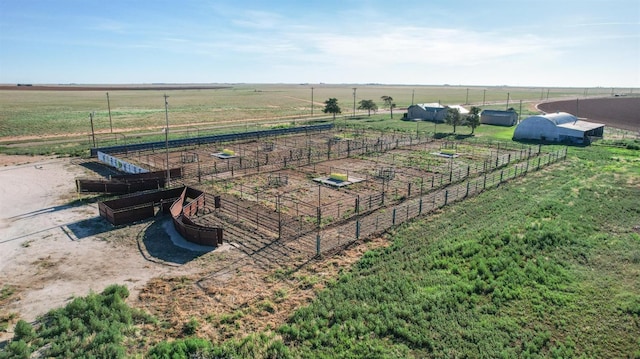 birds eye view of property featuring a rural view