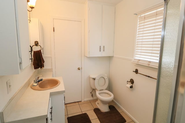 bathroom with vanity, tile patterned floors, and toilet