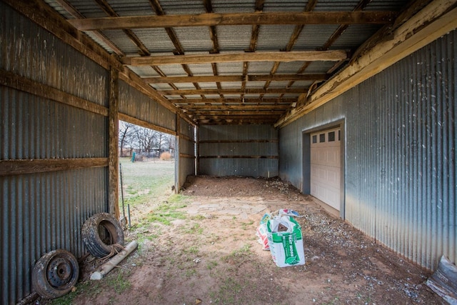 view of yard with a garage and a carport