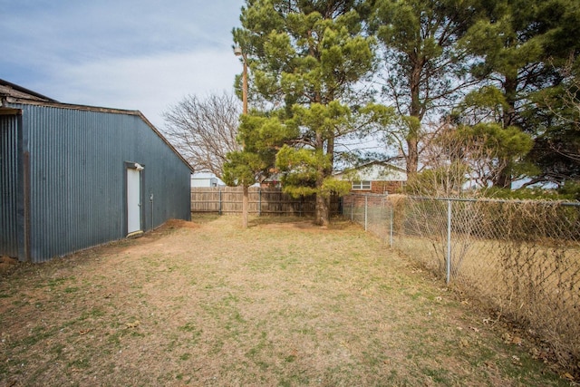 view of yard with a fenced backyard