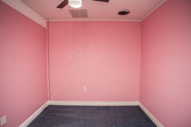 carpeted empty room with baseboards, ceiling fan, and visible vents