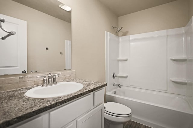 full bathroom with vanity, bathing tub / shower combination, and toilet