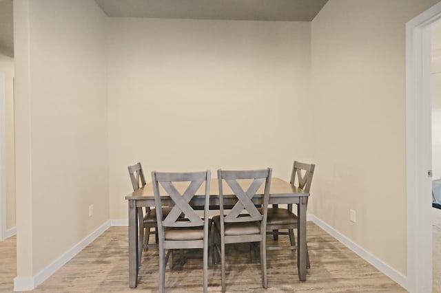 dining area with light wood-type flooring