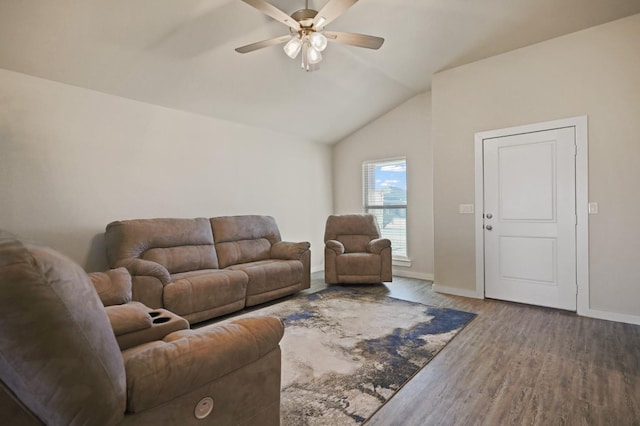 living room with lofted ceiling, hardwood / wood-style floors, and ceiling fan