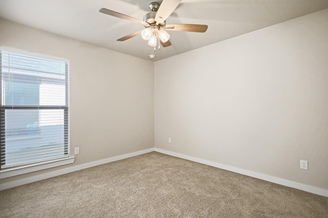 unfurnished room featuring carpet floors and ceiling fan