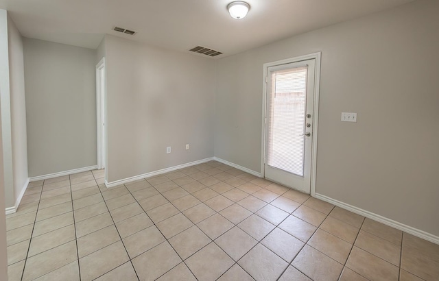 empty room featuring light tile patterned flooring