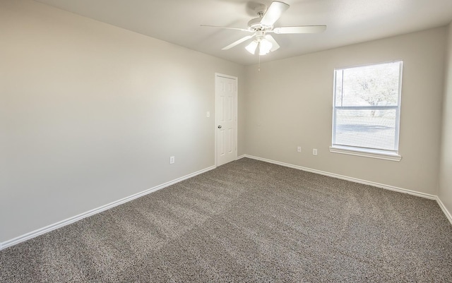 unfurnished room with ceiling fan and carpet flooring