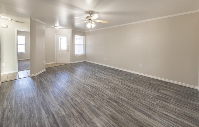 unfurnished room with ceiling fan, crown molding, dark hardwood / wood-style floors, and a healthy amount of sunlight