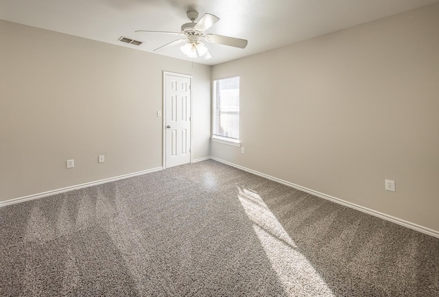 empty room featuring ceiling fan and carpet flooring