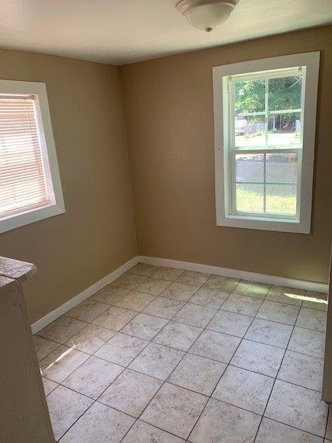 empty room with light tile patterned floors