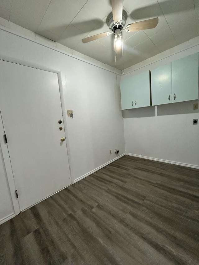 624 Tulane Ave, Big Spring, TX 79720 - spare room with ceiling fan, dark wood-style flooring, and baseboards