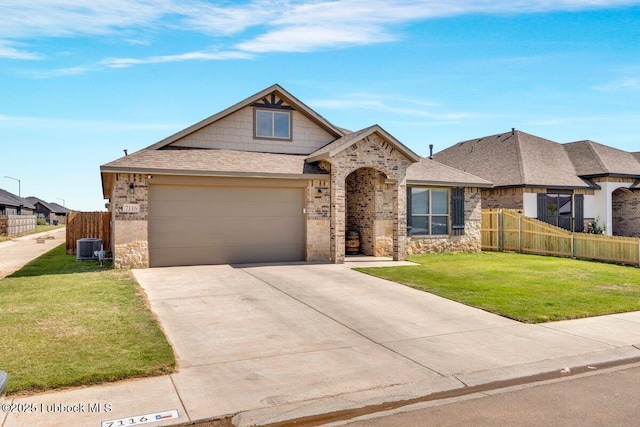 7116 23rd St, Lubbock, TX 79407 - view of front facade with driveway, an attached garage, roof with shingles, central AC unit, and brick siding