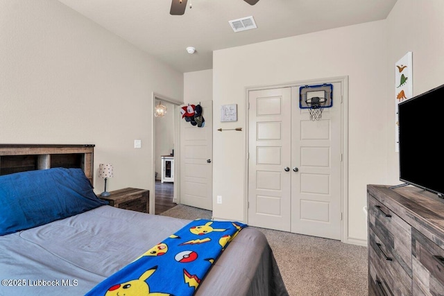 7116 23rd St, Lubbock, TX 79407 - bedroom featuring carpet, a closet, and a ceiling fan