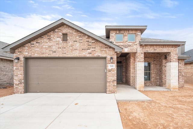 view of front of property with a garage