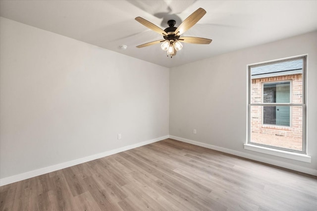 spare room featuring ceiling fan and light wood-type flooring