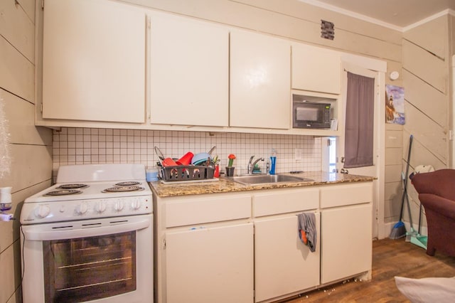 kitchen with sink, backsplash, white cabinets, dark hardwood / wood-style flooring, and white electric range oven