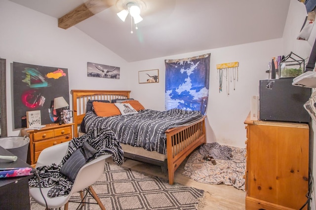 bedroom with ceiling fan and vaulted ceiling with beams