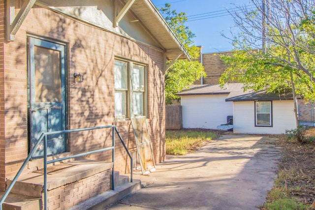 view of side of property featuring a patio