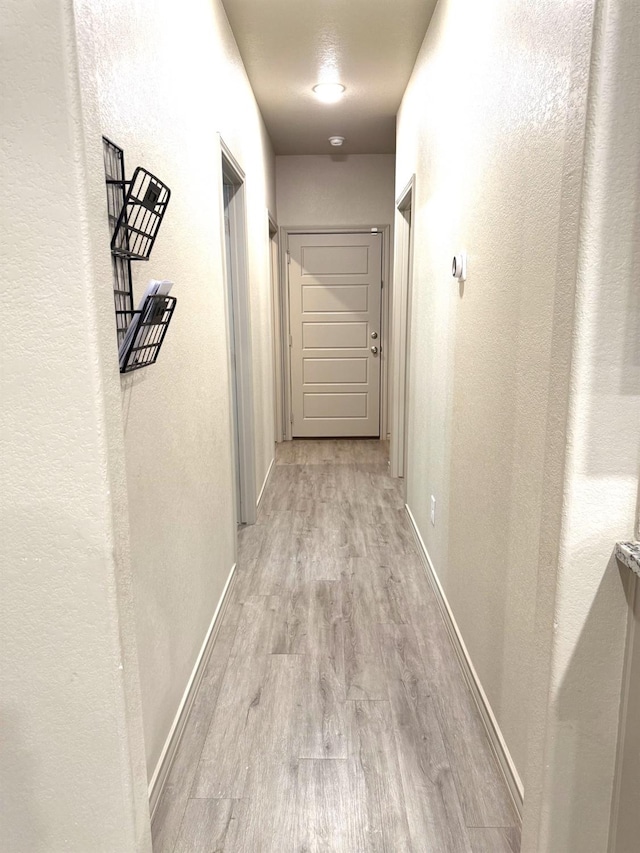 hallway featuring light hardwood / wood-style flooring