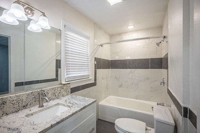 full bathroom featuring vanity, toilet, tiled shower / bath combo, and radiator