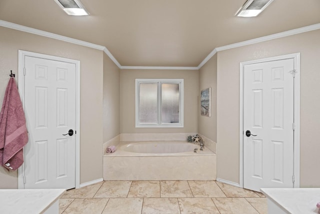 bathroom with vanity, ornamental molding, a washtub, and tile patterned floors