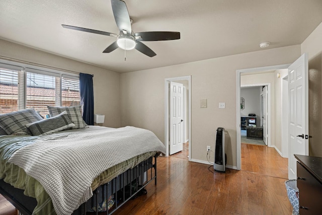 bedroom featuring dark hardwood / wood-style floors and ceiling fan