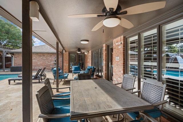 view of patio / terrace featuring ceiling fan