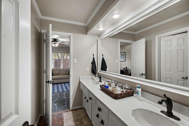 bathroom featuring crown molding and vanity