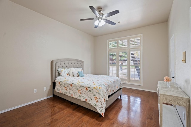 bedroom featuring dark hardwood / wood-style flooring and ceiling fan