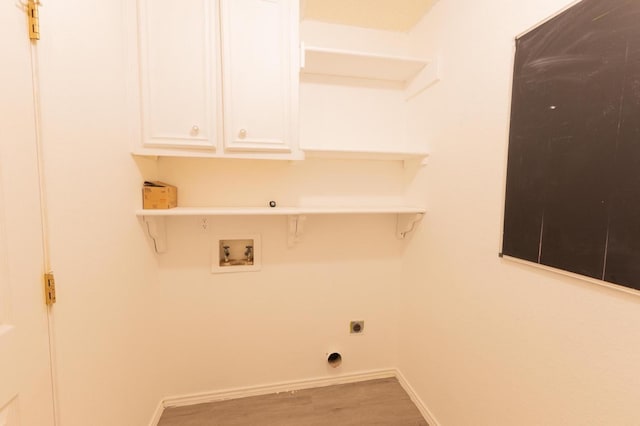 laundry area with hardwood / wood-style flooring, cabinets, washer hookup, and electric dryer hookup