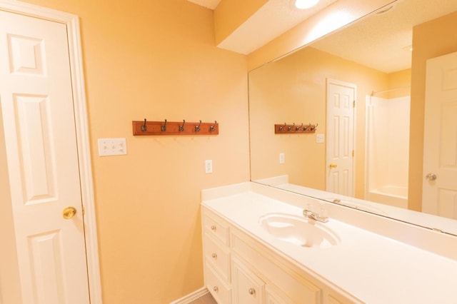 bathroom featuring vanity and walk in shower