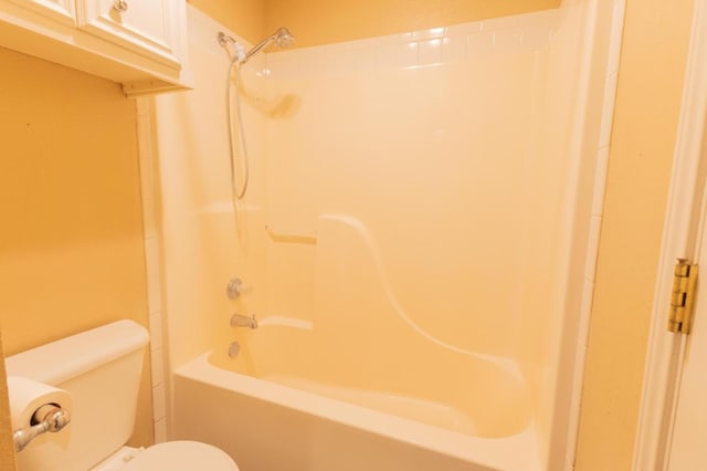 bathroom with toilet and shower / bath combination