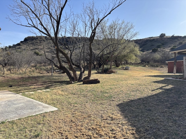 1 Squaw Ln, Ransom Canyon, TX 79366 - view of green lawn with a mountain view