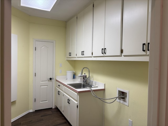 1 Squaw Ln, Ransom Canyon, TX 79366 - laundry area featuring cabinet space, dark wood-style flooring, washer hookup, and a skylight