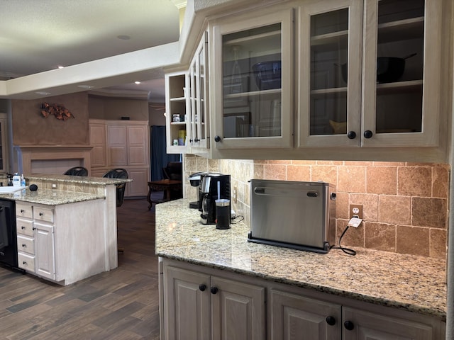 1 Squaw Ln, Ransom Canyon, TX 79366 - kitchen featuring tasteful backsplash, glass insert cabinets, light stone countertops, and dark wood finished floors