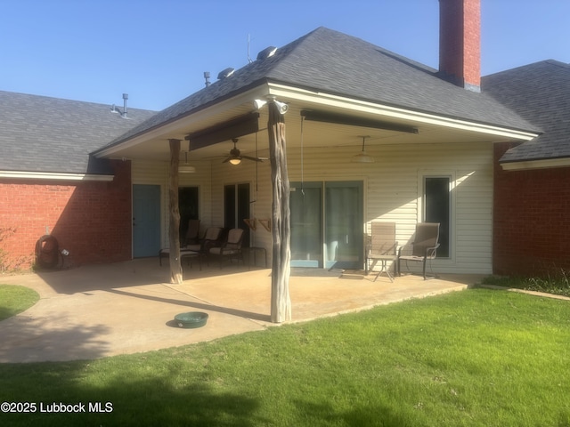 1 Squaw Ln, Ransom Canyon, TX 79366 - back of house with ceiling fan, a lawn, roof with shingles, a patio, and a chimney