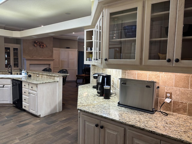 1 Squaw Ln, Ransom Canyon, TX 79366 - kitchen featuring black dishwasher, glass insert cabinets, tasteful backsplash, and light stone countertops