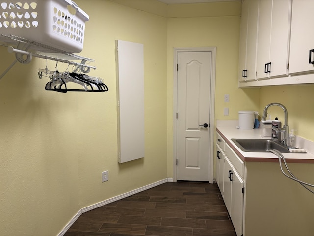 1 Squaw Ln, Ransom Canyon, TX 79366 - kitchen featuring light countertops, dark wood-type flooring, and white cabinetry