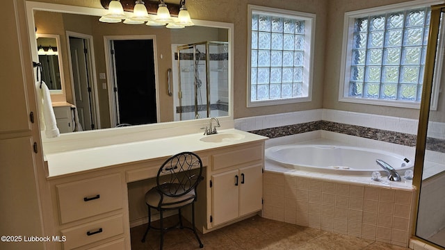 1 Squaw Ln, Ransom Canyon, TX 79366 - bathroom featuring a garden tub, vanity, a shower stall, and tile patterned flooring