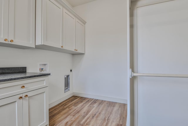 laundry area with cabinets, washer hookup, hookup for an electric dryer, and light hardwood / wood-style floors