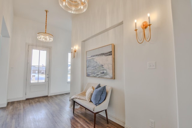 entryway featuring an inviting chandelier and hardwood / wood-style floors