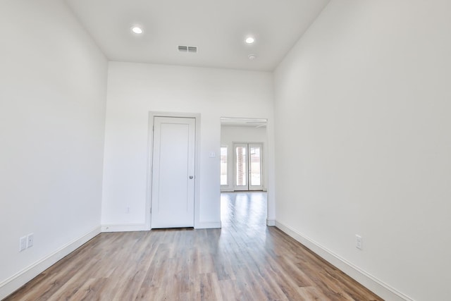 unfurnished room featuring light hardwood / wood-style floors